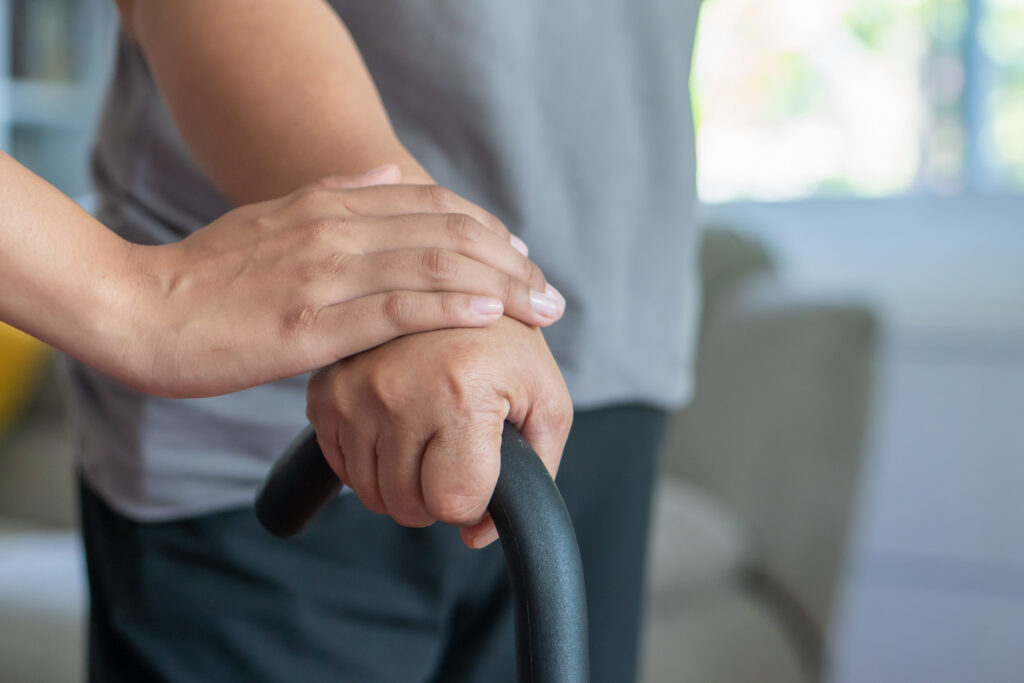 hand holding cane