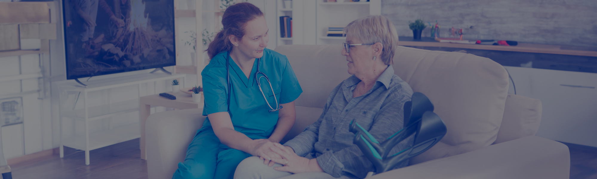 Female assistant talking with senior woman